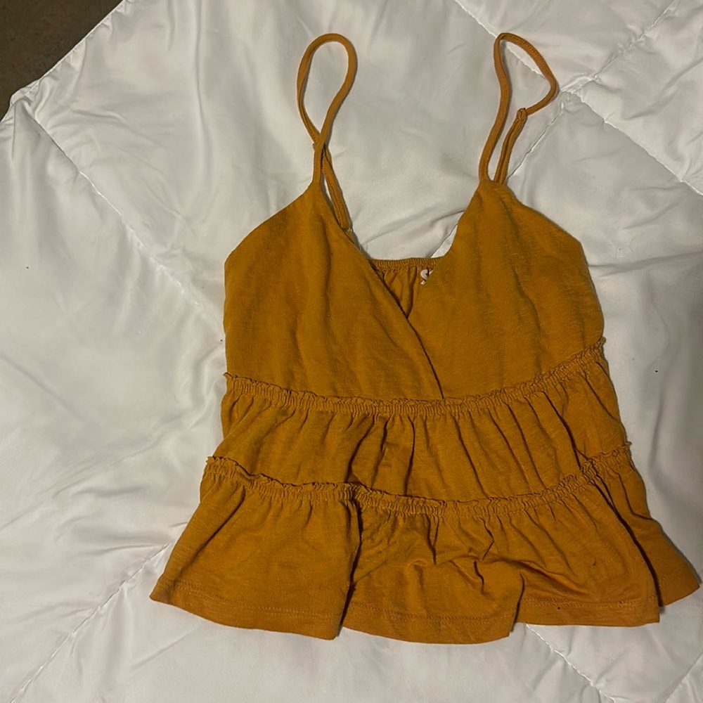 Yellow. SO tank top. Cutsie baby doll style shirt. A good summer tank.